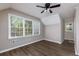 Bright bedroom with hardwood floors and a ceiling fan at 216 Hickory Way, Canton, GA 30115