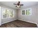 Bright bedroom with hardwood floors and a ceiling fan at 216 Hickory Way, Canton, GA 30115