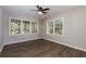 Bright bedroom with hardwood floors and a ceiling fan at 216 Hickory Way, Canton, GA 30115