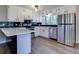 Beautiful updated kitchen featuring stainless steel appliances, modern backsplash, and sleek countertops at 216 Hickory Way, Canton, GA 30115
