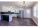 Bright kitchen featuring stainless steel appliances, white cabinets, and a breakfast bar at 216 Hickory Way, Canton, GA 30115