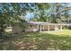 Spacious backyard with a patio and a well-maintained lawn at 2292 Country Club Sw Ln, Atlanta, GA 30311