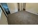 Bedroom with carpeted flooring, closet, and view to the bathroom at 2292 Country Club Sw Ln, Atlanta, GA 30311