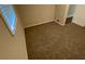 Cozy bedroom with carpet, neutral walls, and a white window at 2292 Country Club Sw Ln, Atlanta, GA 30311