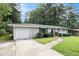 Charming single-story brick home with a well-manicured front lawn and mature trees in a quiet neighborhood at 2292 Country Club Sw Ln, Atlanta, GA 30311