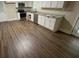 Well-lit kitchen featuring white cabinets, granite countertops, and stainless steel appliances, perfect for cooking at 2292 Country Club Sw Ln, Atlanta, GA 30311