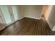Bright living room featuring hardwood flooring and a french door, perfect for relaxing and entertaining at 2292 Country Club Sw Ln, Atlanta, GA 30311