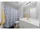 Bathroom with blue patterned shower curtain and vanity at 3123 Westbrook Trce, Lawrenceville, GA 30044