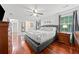 This bedroom features hardwood floors, a gray bed frame, and modern ceiling fan at 3123 Westbrook Trce, Lawrenceville, GA 30044
