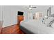 Bedroom with wood floors, closet, and a mounted television at 3123 Westbrook Trce, Lawrenceville, GA 30044
