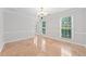 Bright dining room with neutral walls and tile flooring, bathed in natural light from large windows at 3123 Westbrook Trce, Lawrenceville, GA 30044