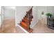 Foyer features tile flooring, staircase, gray walls, and an entry to the dining room at 3123 Westbrook Trce, Lawrenceville, GA 30044
