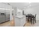 Spacious kitchen with stainless steel appliances, granite countertops, and an island with seating at 3123 Westbrook Trce, Lawrenceville, GA 30044