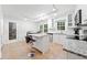 Bright kitchen with island seating, stainless steel appliances, and tile flooring at 3123 Westbrook Trce, Lawrenceville, GA 30044