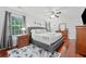 Comfortable main bedroom features hardwood floors, natural light and classic decor at 3123 Westbrook Trce, Lawrenceville, GA 30044