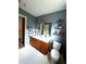 Modern bathroom featuring a dual sink vanity, toilet and neutral paint at 3439 Tupelo Trail, Auburn, GA 30011