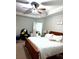 Cozy bedroom with a large ceiling fan, and a king-size bed at 3439 Tupelo Trail, Auburn, GA 30011