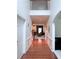 Open foyer featuring hardwood floors and high ceilings, leading into other rooms of the home at 3439 Tupelo Trail, Auburn, GA 30011