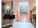 Open-concept hallway with hardwood floors, arched doorways, and access to the living room and kitchen at 3439 Tupelo Trail, Auburn, GA 30011
