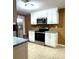 Kitchen featuring white cabinets and stainless steel appliances at 3439 Tupelo Trail, Auburn, GA 30011