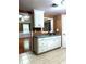 Open kitchen featuring white cabinets, stainless steel sink and natural light at 3439 Tupelo Trail, Auburn, GA 30011