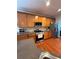 Kitchen featuring hardwood floors, wood cabinets, stainless appliances, and granite countertops at 3439 Tupelo Trail, Auburn, GA 30011