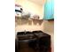Organized laundry room with front loading washer and dryer and practical overhead storage at 3439 Tupelo Trail, Auburn, GA 30011