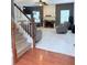 Inviting living room featuring a staircase, fireplace, and comfortable seating arrangement at 3439 Tupelo Trail, Auburn, GA 30011