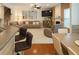 Spacious living room with tile floors, ceiling fan, and large windows at 3439 Tupelo Trail, Auburn, GA 30011