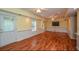 Large living room with hardwood floors and good light at 3439 Tupelo Trail, Auburn, GA 30011