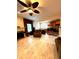Open-concept living room with a fireplace, dining area, and bar for an easy entertaining experience at 3439 Tupelo Trail, Auburn, GA 30011