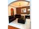 Comfortable living room with leather seating, neutral walls, and modern lighting at 3439 Tupelo Trail, Auburn, GA 30011