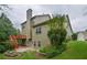 Exterior view of home showcasing deck, chimney, and landscaped backyard at 3439 Tupelo Trail, Auburn, GA 30011