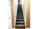 Carpeted staircase with a white railing in a home at 3439 Tupelo Trail, Auburn, GA 30011