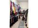 Spacious walk-in closet with ample shelving and hanging space for clothes and accessories at 3439 Tupelo Trail, Auburn, GA 30011