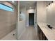 Bathroom with a walk-in shower and double sink vanity at 5444 Miravista Way, Hoschton, GA 30548