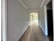 Hallway in the house leads to other rooms at 5444 Miravista Way, Hoschton, GA 30548