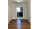 Dining area featuring hardwood floors looking through the doorway into the kitchen at 2367 Cascade Rd # B7, Atlanta, GA 30311