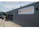 Exterior view of Reatha's At The Point building with grey brick and sign at 2367 Cascade Rd # B7, Atlanta, GA 30311