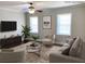 Cozy staged living room with neutral tones, recessed lighting, and hardwood flooring at 2367 Cascade Rd # B7, Atlanta, GA 30311