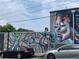 Colorful exterior mural artwork in Cascade Heights with parking in front of the building at 2367 Cascade Rd # B7, Atlanta, GA 30311