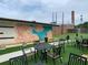 Outdoor seating area with faux grass and a painted flower mural in the background at 2367 Cascade Rd # B7, Atlanta, GA 30311