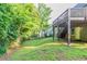 Lush backyard featuring a well manicured lawn with mature trees at 4252 Keheley Lake Dr, Marietta, GA 30066