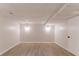 Spacious basement with light colored floors and neutral walls with recessed lighting at 4252 Keheley Lake Dr, Marietta, GA 30066