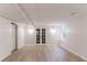 Bright basement featuring light colored floors, french doors, and recessed lighting at 4252 Keheley Lake Dr, Marietta, GA 30066