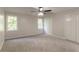 Serene bedroom featuring carpet flooring, large windows, and closet at 4252 Keheley Lake Dr, Marietta, GA 30066