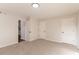 Neutral bedroom with carpet, two closets and a door leading to another room at 4252 Keheley Lake Dr, Marietta, GA 30066