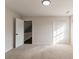 Neutral bedroom with carpet and a closet that is filled with sunlight at 4252 Keheley Lake Dr, Marietta, GA 30066