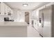 Bright kitchen with stainless steel appliances, white cabinets, and quartz countertops at 4252 Keheley Lake Dr, Marietta, GA 30066