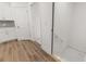 A basement entrance features wooden flooring and white walls at 55 Black Rock Rdg, Sharpsburg, GA 30277